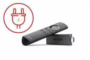 An Amazon Fire TV remote with a power cord next to it, perfect for effortlessly turning off your device or controlling your Amazon Fire Stick.